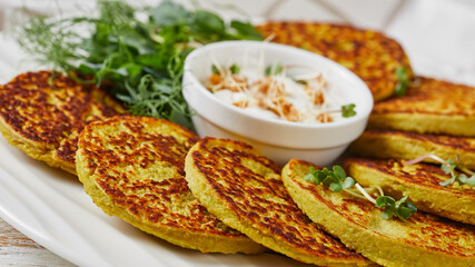 green pea and oatmeal pancakes on a plate