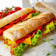 crispy baguette with bacon, tomatoes and cheese
