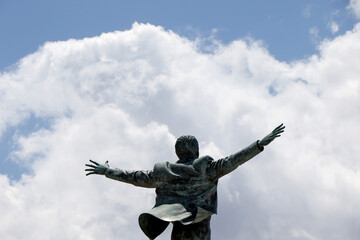 Bronze statue dedicated to the Italian singer Domenico Modugno on the promenade of Polignano a...