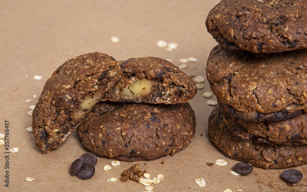 Poster Closeup shot of several chocolate cookies on top of each other