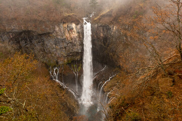 View of Kegon Falls from Lower Observation Deck during foggy day in autumn, Nikko, Japan