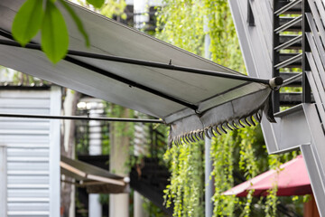black awning of shop in garden.