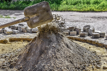 Preparation of a dry cement-sand mixture for the repair of stone paving slabs, garden paths,...