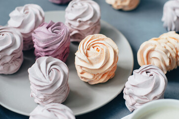 Colorful Air marshmallows on gray background. Fresh homemade sweet zephyr