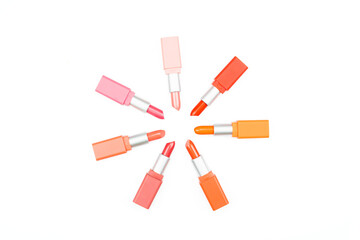 beautiful color pastel lipsticks arranged on white background with copy space,beauty and makeup concept
