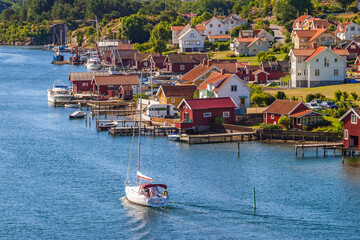 Fototapeta na wymiar Sailing boat in the canal at Hamburgsund in Sweden