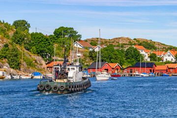 Fototapeta na wymiar Tugboat at Hamburgersund an old Swedish fishing village