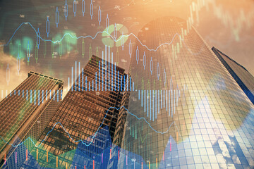 Forex chart on cityscape with skyscrapers wallpaper multi exposure. Financial research concept.