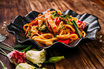 Asian cuisine vegetables udon noodles wok