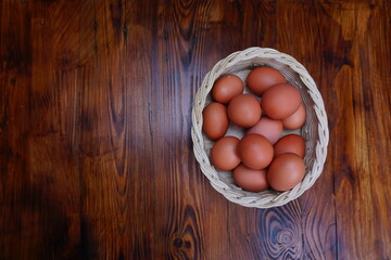 Organic chicken eggs on the traditional bamboo basket. Fresh Eggs with Rustic background