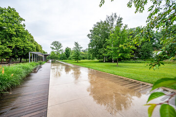 Empty park full of green with nobody.