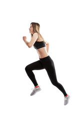 Running young girl in sportswear. Side view. Movement, sport and health. Isolated on a white background. Vertical.