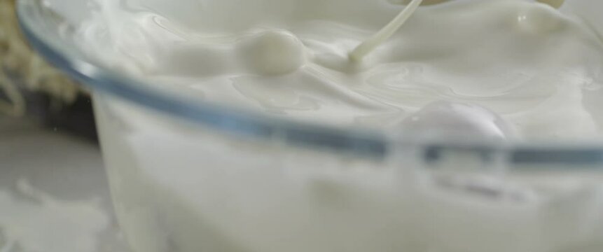 Strawberry falls into milk Slow Motion Macro