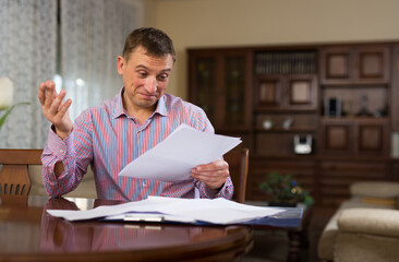 Man checking accountancy at home