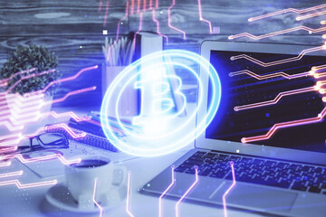 Double exposure of blockchain and crypto economy theme hologram and table with computer background....