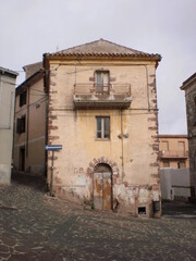 Fototapeta na wymiar Old classic vintage building in vintage town in Sardinia, Italy, Bosa