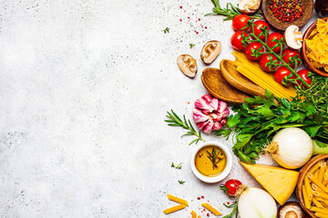 Cooking pasta ingredients background. Raw ingredients for the cooking of Italian pasta, top view,...