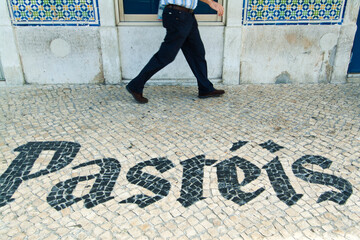 advertisement for a pastry made in traditional pavement called calcada in Lisbon