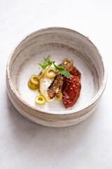 olives, dried tomatoes, cream cheese and snack on white marble background with copy space