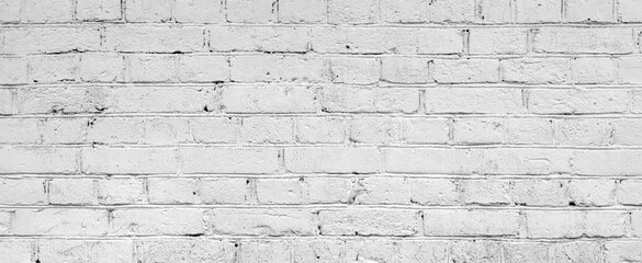 Obraz premium White brick wall. Facade of an old building. Architectural background.