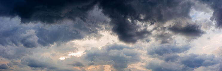 Fototapeta na wymiar Panorama of the evening sky with storm clouds