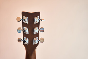 Acoustic guitar headboard with pegs. Guitar fretboard. Fretboard acoustic guitar. Close-up. Hobby