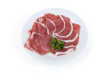 Tenderized boneless raw pork chops on the white dish