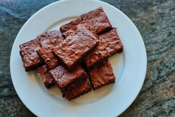 Top View Brownies served on White Plate. Homemade Gluten Free Brownie baked during Quarantine in Czech Republic.