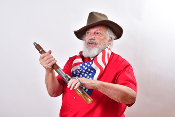 Determined looking old man is cocking his sawed off rifle, sometimes called 
