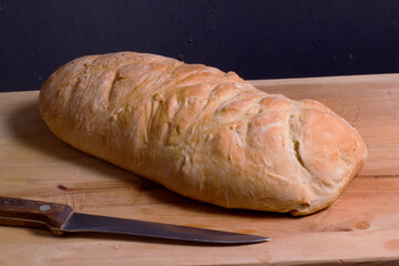 Homemade wholegrain rye bread on wooden cutting Board.