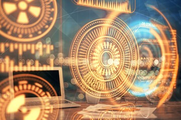 Computer on desktop in office with technology theme hologram. Multi exposure. Tech concept.