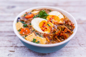 Ramen soup with noodles and traditional ingredients.