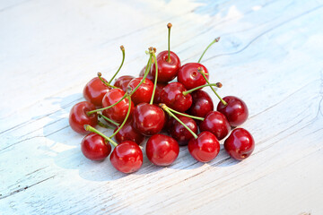 Obraz na płótnie Canvas Pile of fresh red cherries on a market table