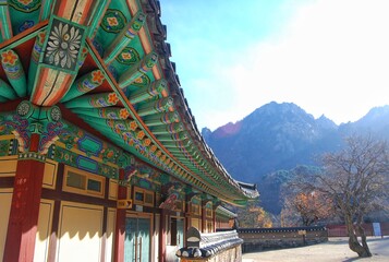 Buddhist Architecture of Sinheungsa Temple with Mountain Background in Seoraksan National Park. - obrazy, fototapety, plakaty