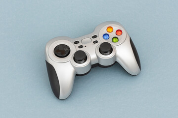 PC wireless game controller (gamepad) on the blue background. © dnd_project
