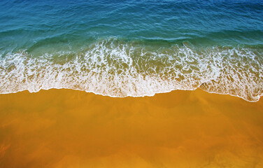 Wave of blue ocean on  beach.
