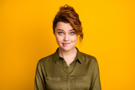 Close-up portrait of her she nice attractive lovely pretty cute cheerful sly wavy-haired girl biting lip thinking isolated on bright vivid shine vibrant yellow color background