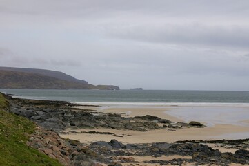 Fototapeta na wymiar The sandy, wild and desolate local beach at Durness, Sutherland, Scotland.