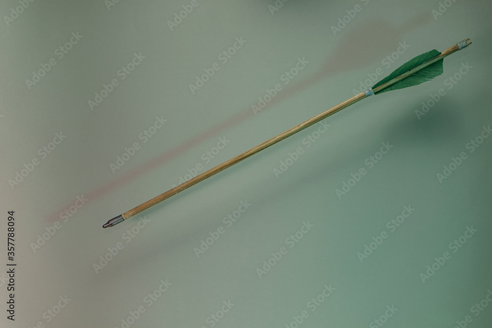 Poster Old green arrow in the color light. Beautiful old arrows minimal in neon light. Minimalism retro style concept. Background pattern for design.