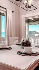 Vertical Dining room with mountain lake neighborhood and porch view through the windows