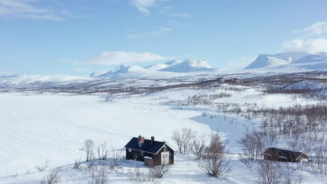 Flying above the frozen Tornetr&auml;sk Lake and towards Lapporten. Swedish Lapland.