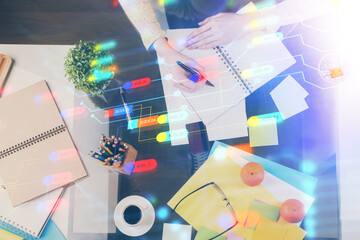 Double exposure of writing hand on background with data solution technology hologram. Ai concept.