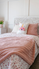 Vertical frame Bedroom interior with decorative headboard and feminine beddings on single bed