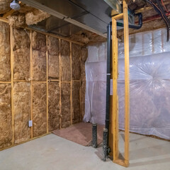 Square crop Insulation inside the room of a frame house