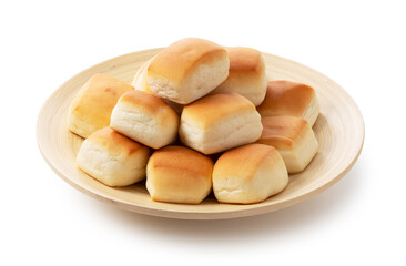 Dinner rolls on a wooden plate.