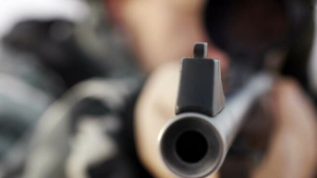 stock footage hunter with rifle with telescopic sight