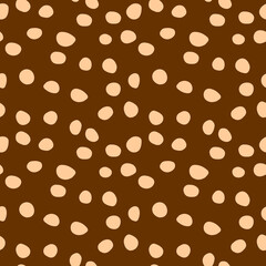 Background polka dot. Seamless pattern. Random dots, circles, animal skin. Design for fabric, wallpaper. Irregular random abstract vector texture. Repeating graphic backdrop