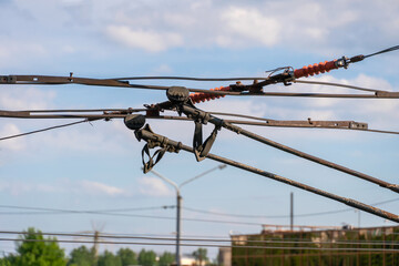 Trolleybus horns, wires on the line for trolleybuses close-up against the sky.