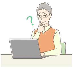 パソコンを操作して悩む男性