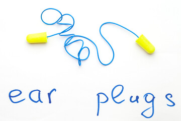 Modern green ear plugs on a white background. lace earplugs